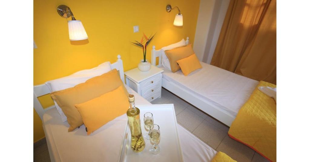 A bed or beds in a room at Athina Apartments