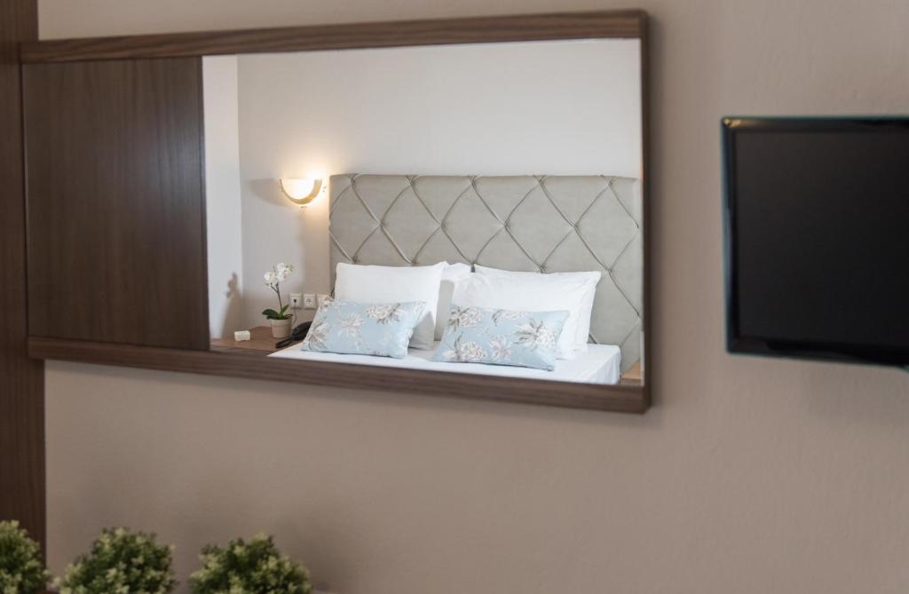 Postel nebo postele na pokoji v ubytování Hotel Olga