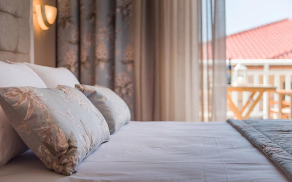 Postel nebo postele na pokoji v ubytování Hotel Olga