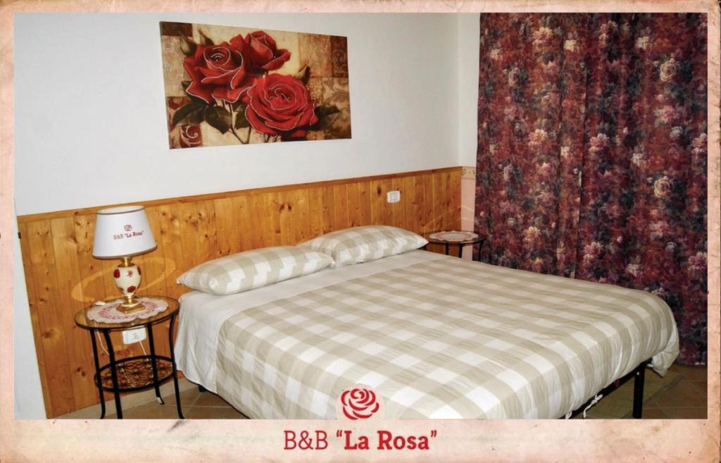 Letto o letti in una camera di B&B La Rosa