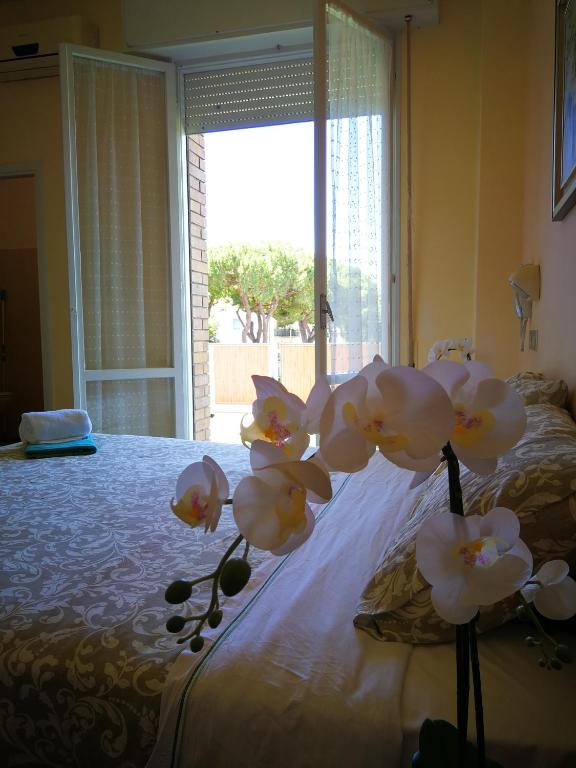 Postel nebo postele na pokoji v ubytování Hotel Rossella