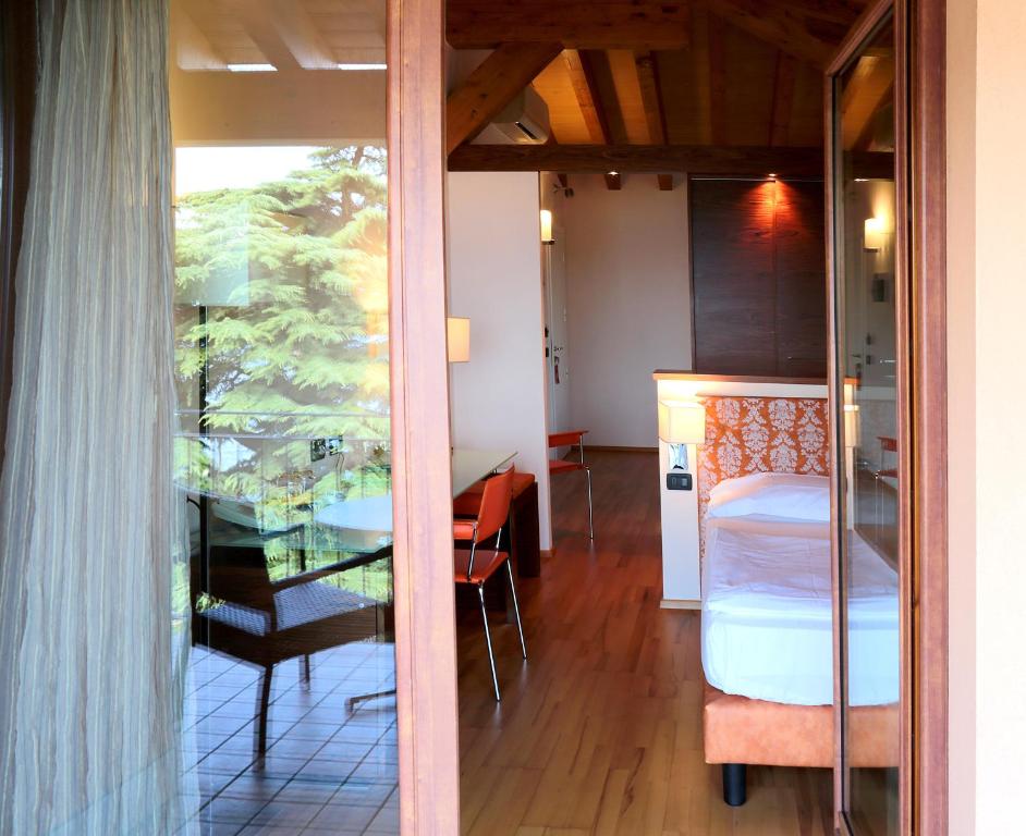 Łóżko lub łóżka w pokoju w obiekcie Hotel Lido