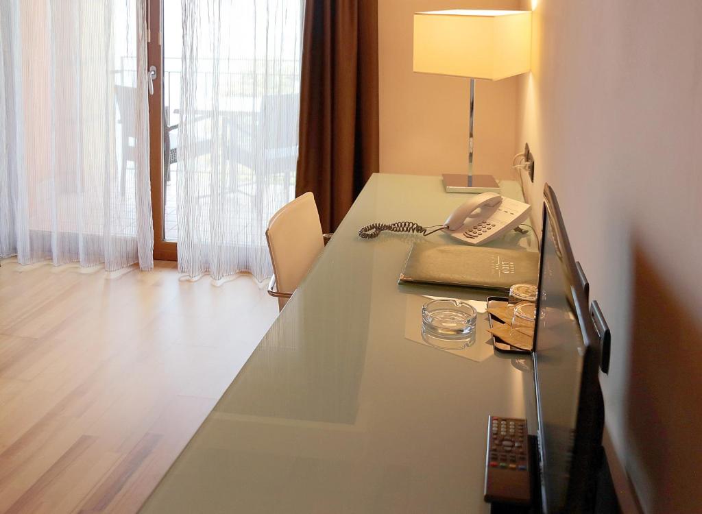 Łóżko lub łóżka w pokoju w obiekcie Hotel Lido