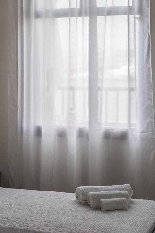 Postel nebo postele na pokoji v ubytování Captain Vasilis Hotel