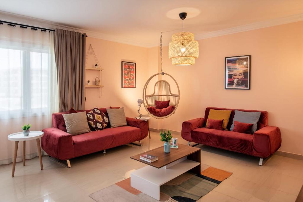 Posezení v ubytování The 2BDR Compelling Condo 5 min to CAI Airport