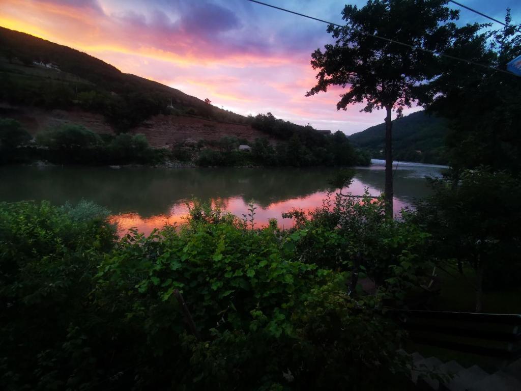 a view of a river at sunset at Vikendica pored Drine Foča in Handići