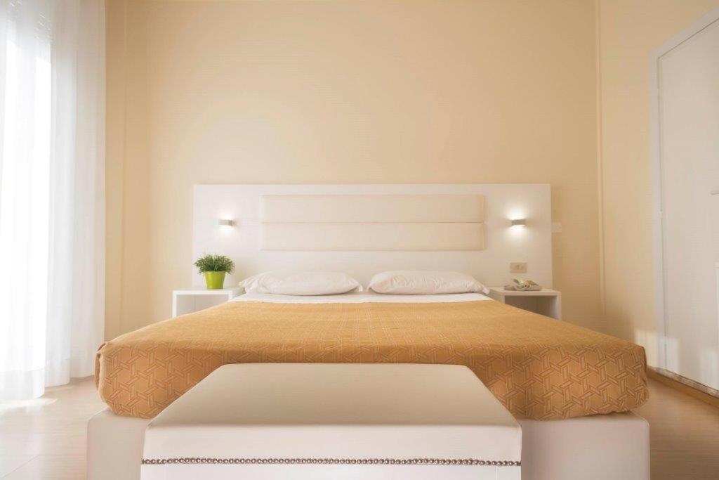 Postel nebo postele na pokoji v ubytování Hotel San Domingo