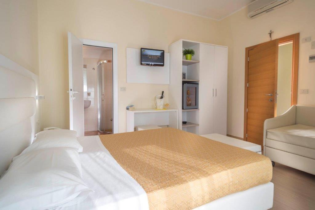 Postel nebo postele na pokoji v ubytování Hotel San Domingo