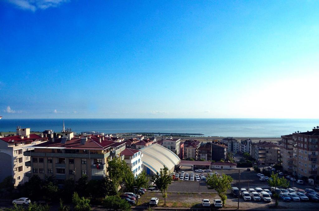 a view of a city with the ocean in the background at Konaklar Apart Premium in Trabzon