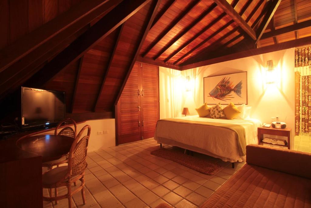 Postel nebo postele na pokoji v ubytování Pontal dos Carneiros Beach Bungalows
