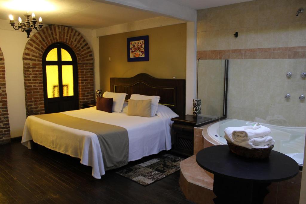 Postel nebo postele na pokoji v ubytování Spa Holistico Real Hotel