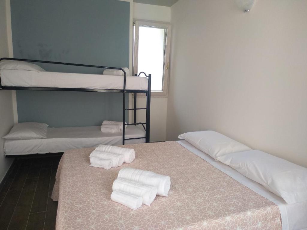 Łóżko lub łóżka w pokoju w obiekcie B&B L'Antica Dimora ...e dei mestieri