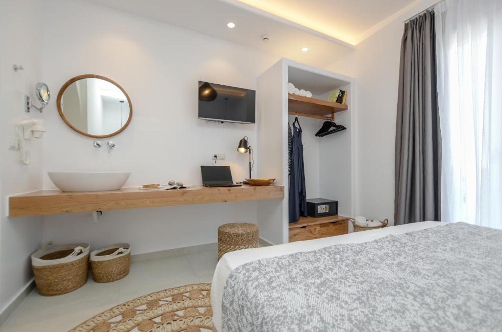 Postel nebo postele na pokoji v ubytování Sea & Olives Suites Hotel and Villas