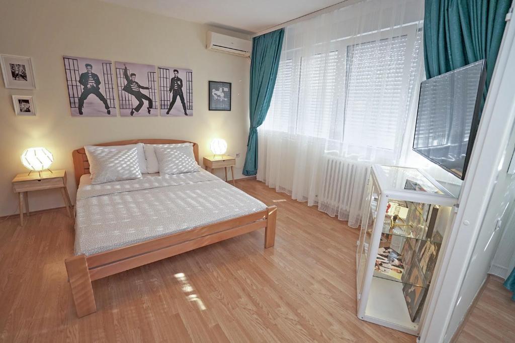 Postel nebo postele na pokoji v ubytování Apartment Elvis