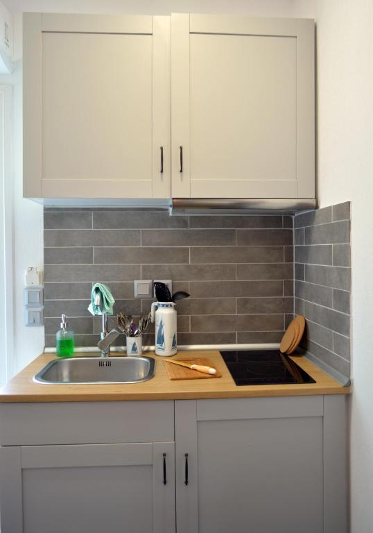 Kuchyň nebo kuchyňský kout v ubytování Kartalia apartment