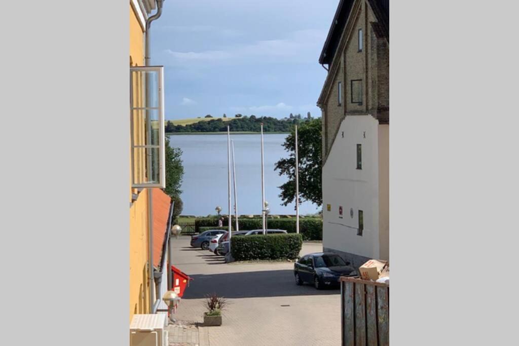 a view of a car parked in a parking lot at Lejlighed på Torvet i Stege in Stege