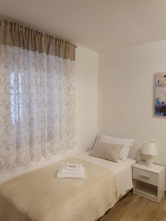 Postel nebo postele na pokoji v ubytování Rooms Marija