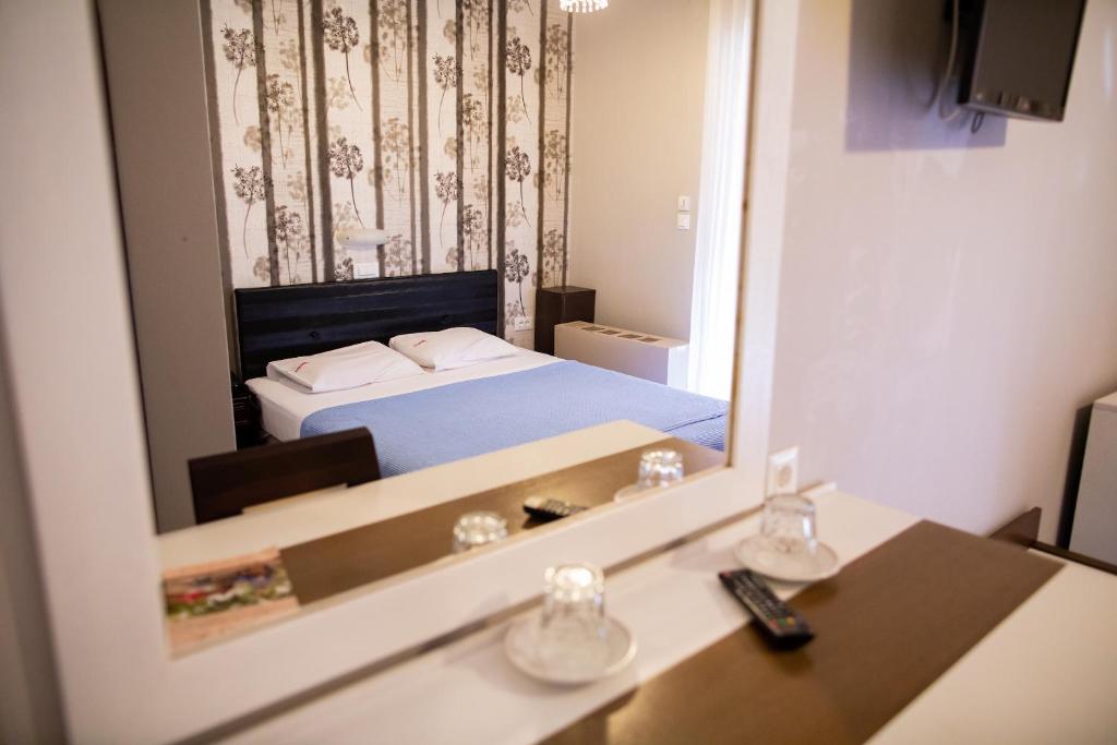 Postel nebo postele na pokoji v ubytování Fanari Hotel