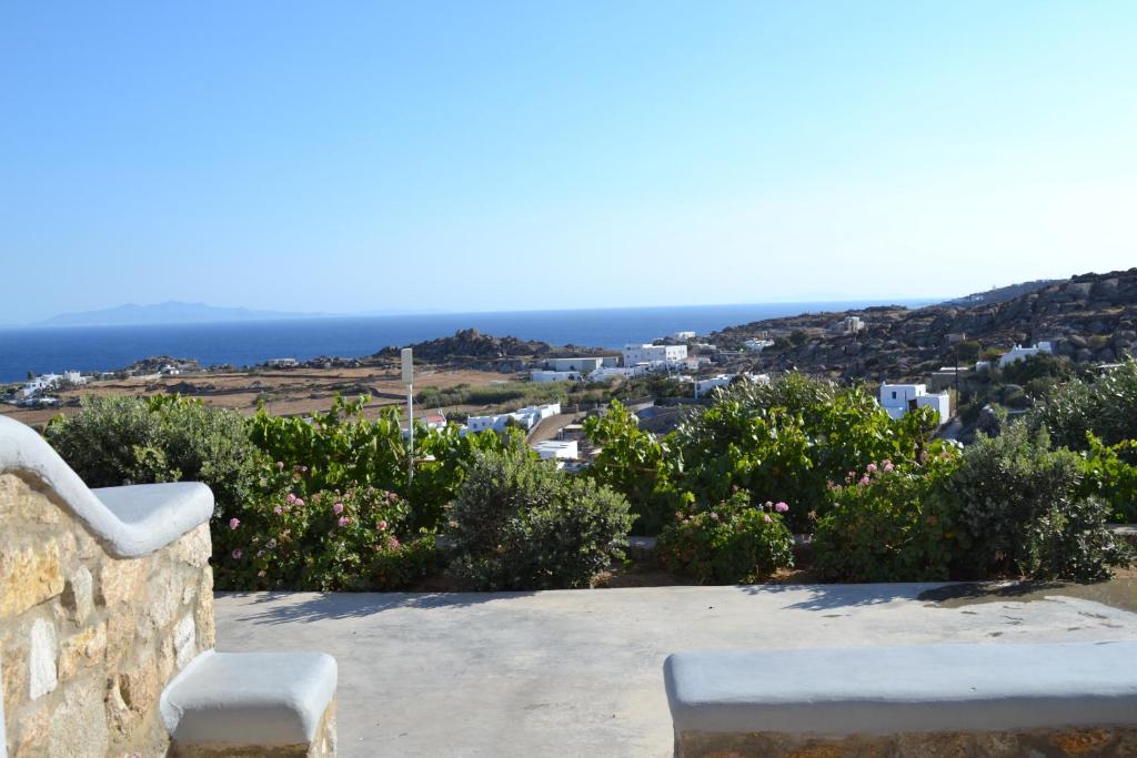 a view of the ocean from a house at Oniropetra Apartments Mykonos in Plintri