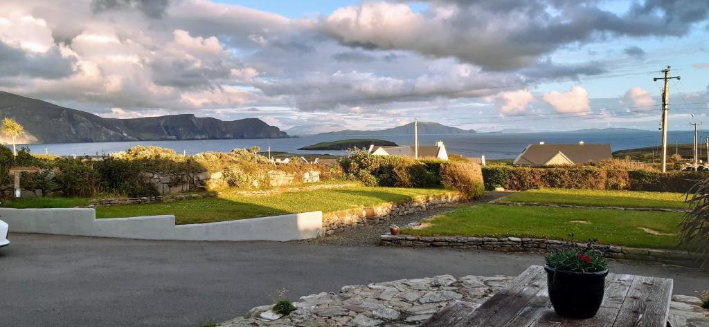 a house with a view of the water and mountains at Creevagh (Room Only) in Keel