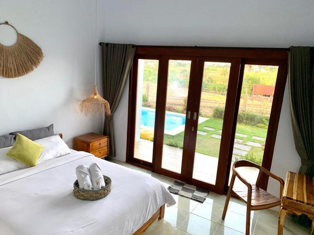 Postel nebo postele na pokoji v ubytování Pratama Guest House