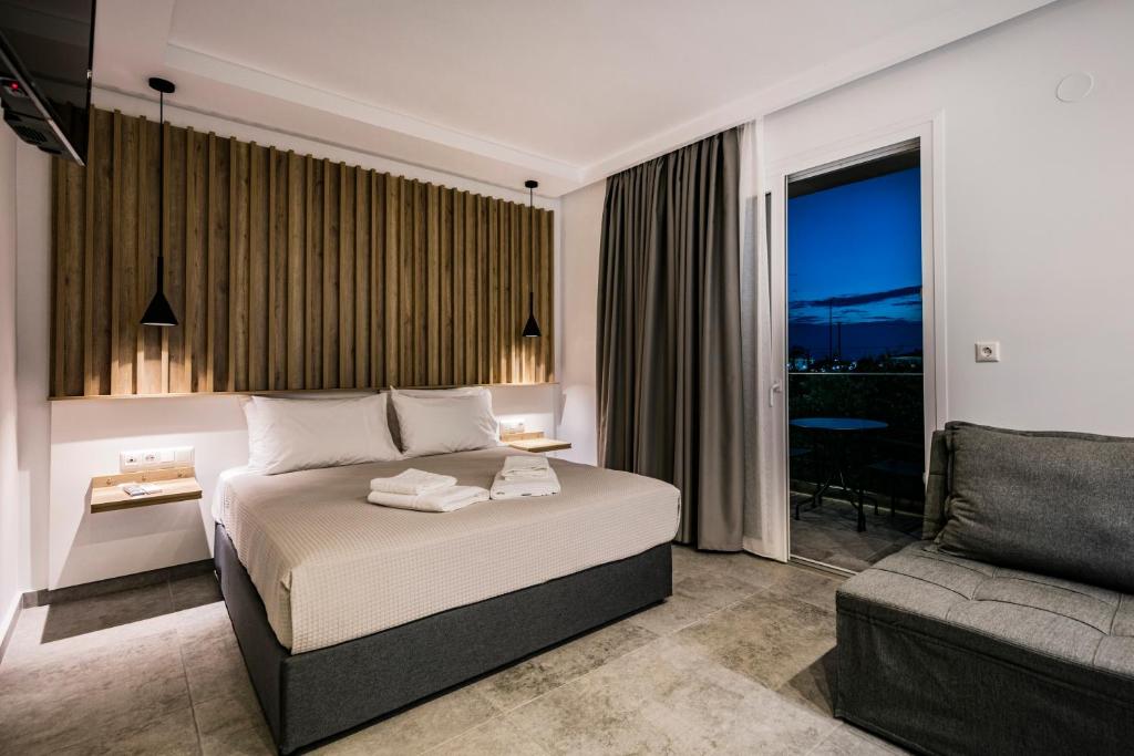 En eller flere senger på et rom på Harmony Thassos suites & Apartments