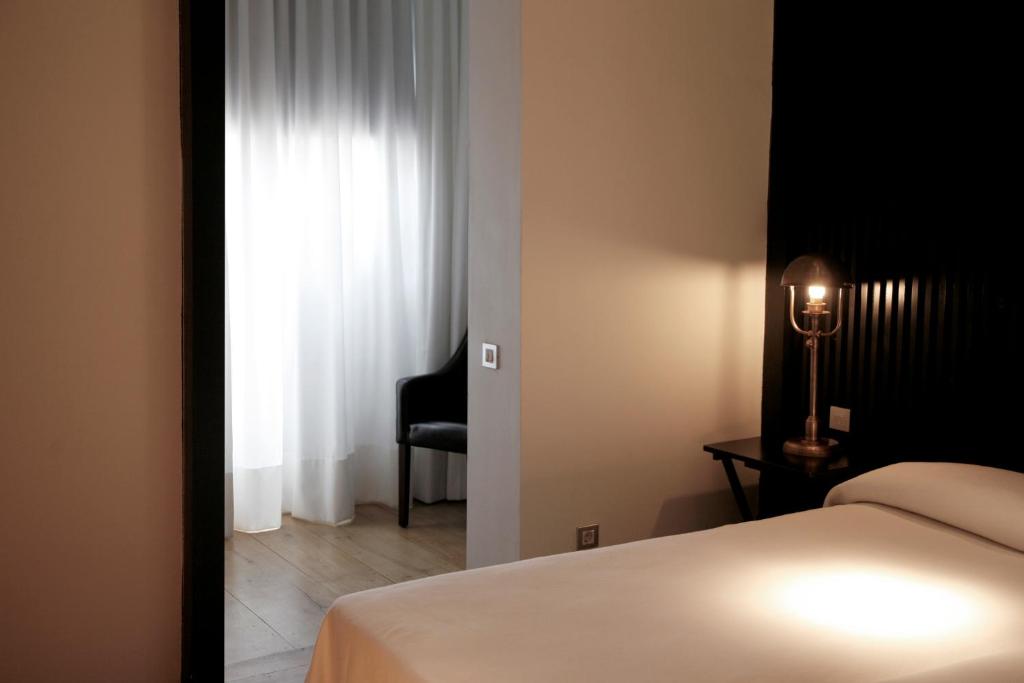 A bed or beds in a room at Hotel Market