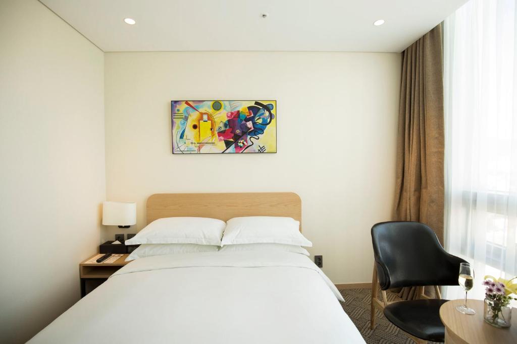 Postel nebo postele na pokoji v ubytování Best Western Haeundae Hotel