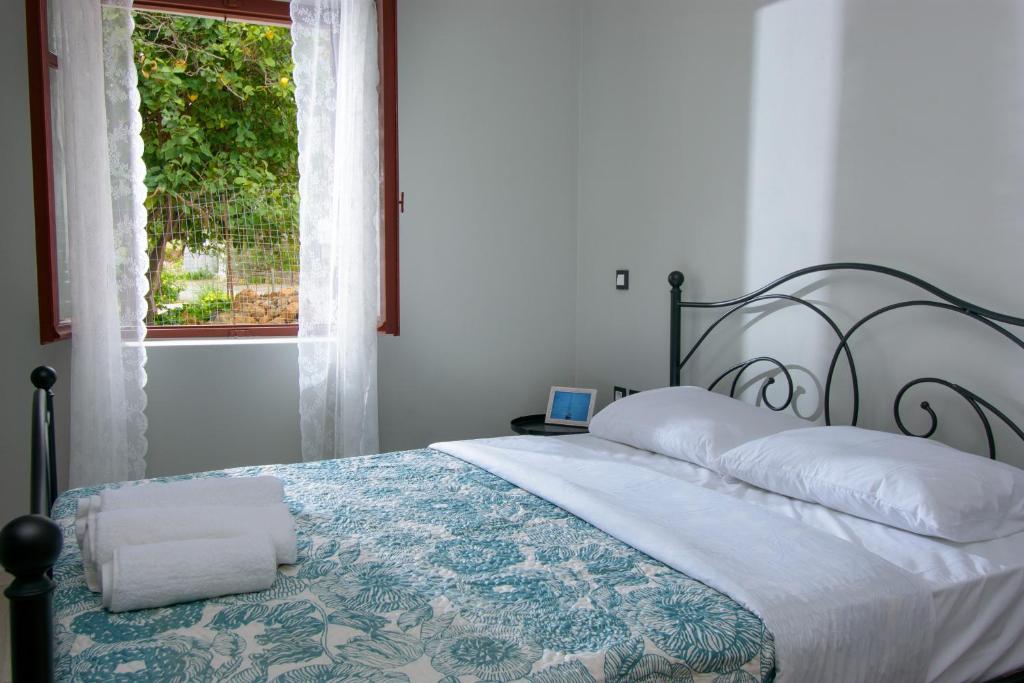 Postel nebo postele na pokoji v ubytování Pavlakis Lemon-Tree House