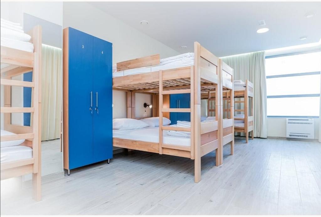 Postel nebo postele na pokoji v ubytování AI HOSTEL