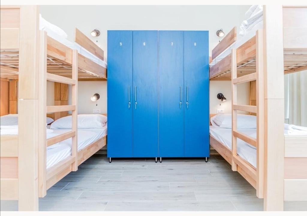 Postel nebo postele na pokoji v ubytování AI HOSTEL