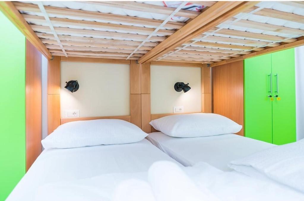 Postel nebo postele na pokoji v ubytování AI HOSTEL