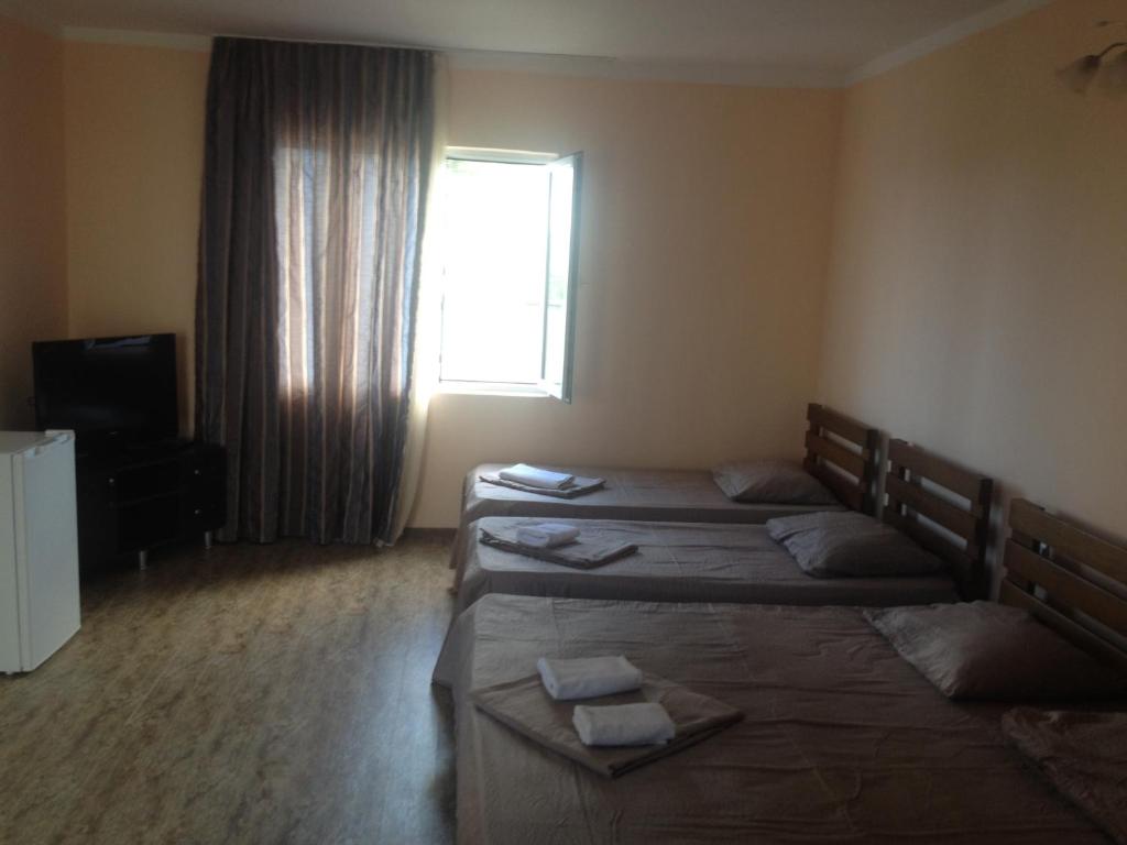 Voodi või voodid majutusasutuse Hotel Premium toas
