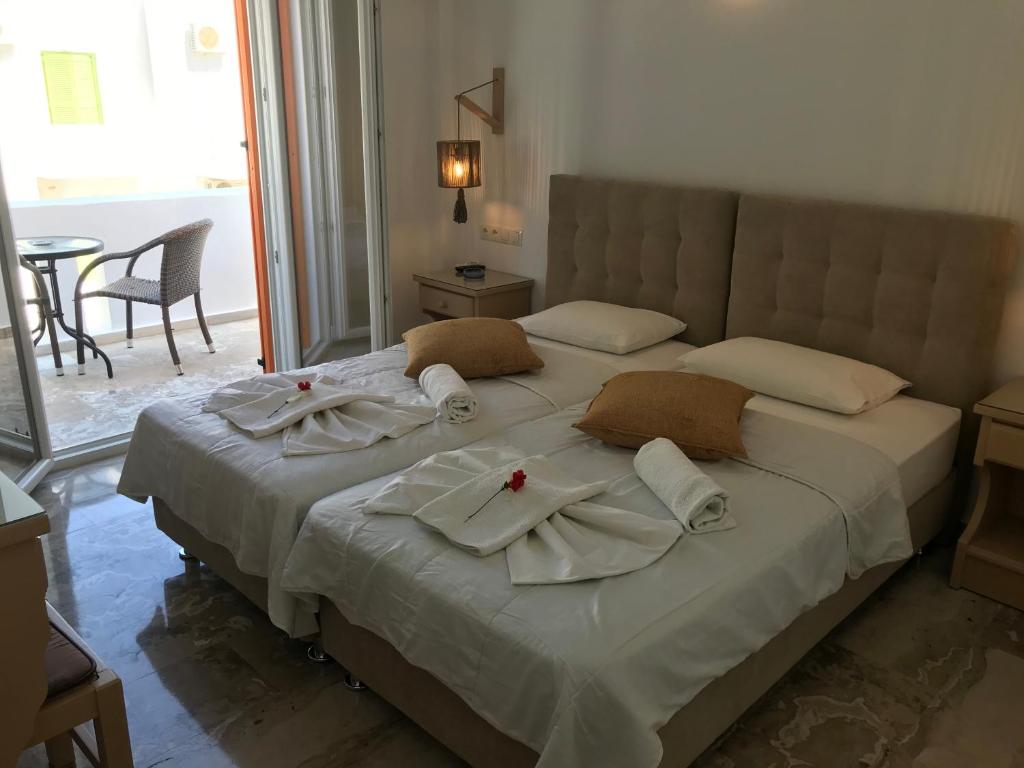 Postel nebo postele na pokoji v ubytování Vassiliki Rooms