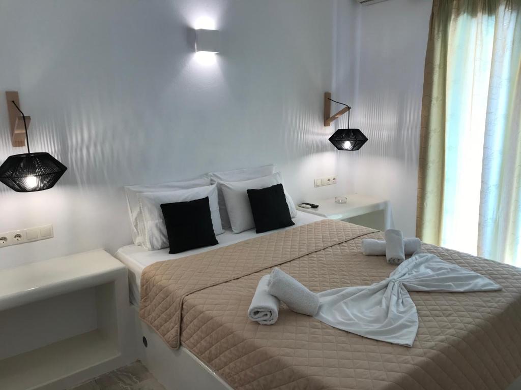 Postel nebo postele na pokoji v ubytování Vassiliki Rooms
