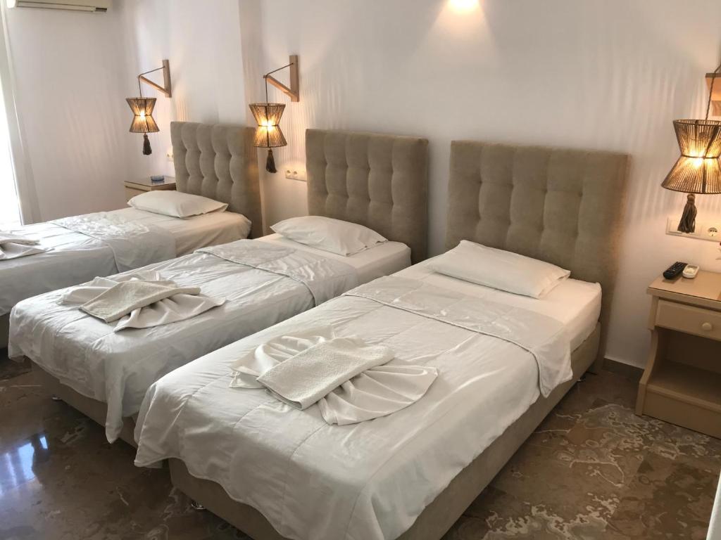 Postel nebo postele na pokoji v ubytování Vassiliki Rooms