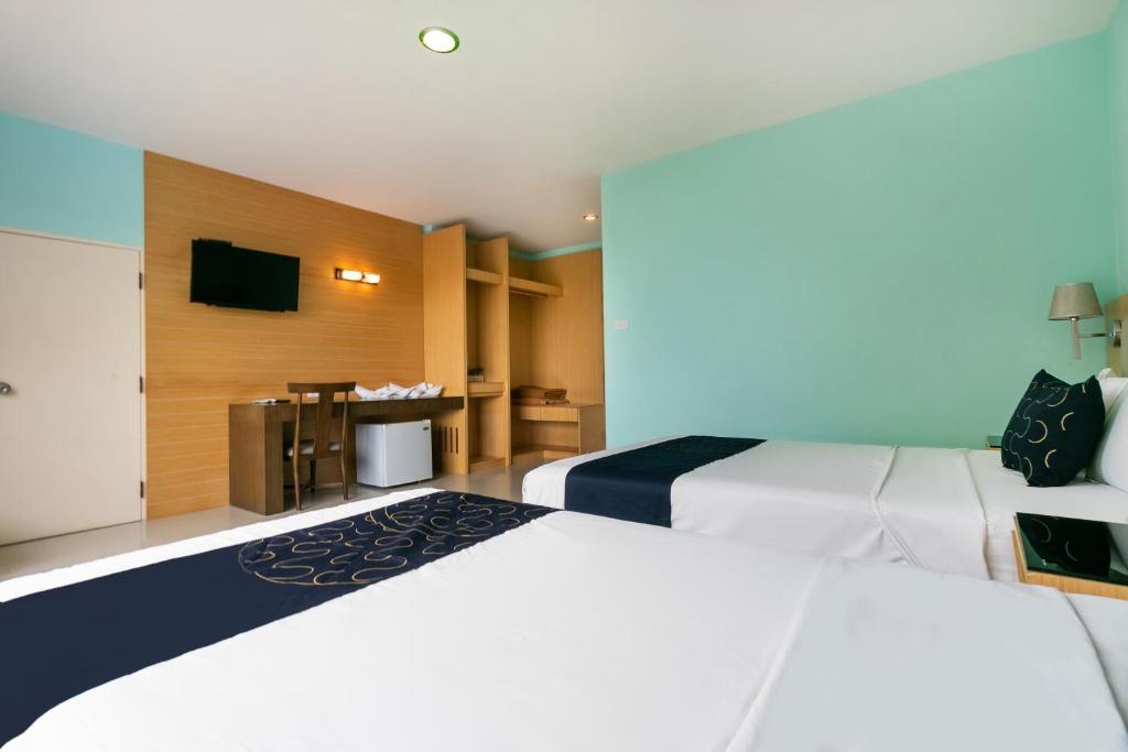 Postel nebo postele na pokoji v ubytování Golden Beach Boutique Resort