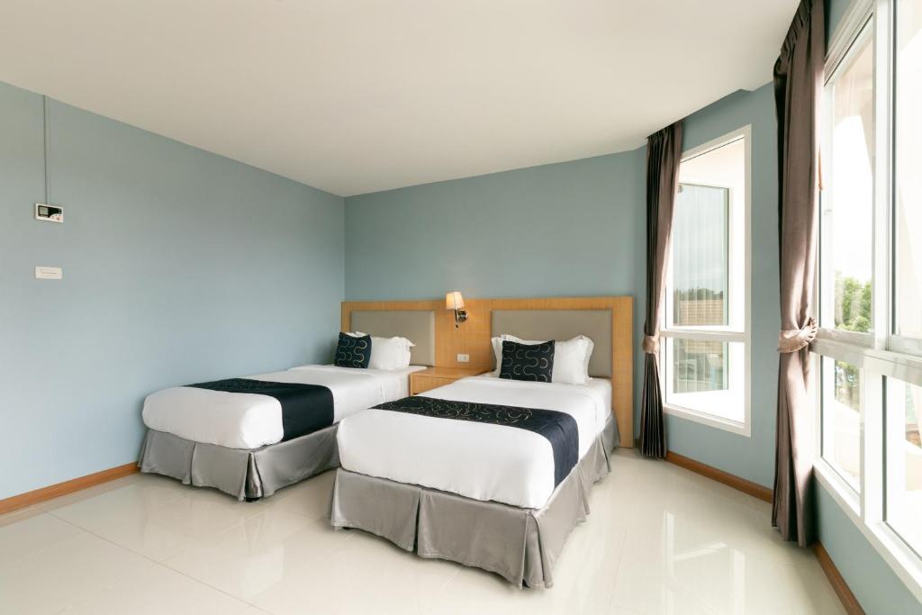 Postel nebo postele na pokoji v ubytování Golden Beach Boutique Resort