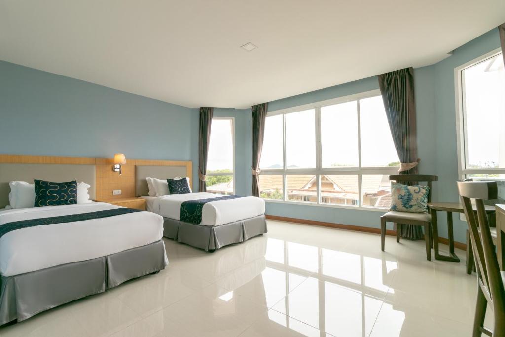 Postel nebo postele na pokoji v ubytování Golden Beach Boutique Resort