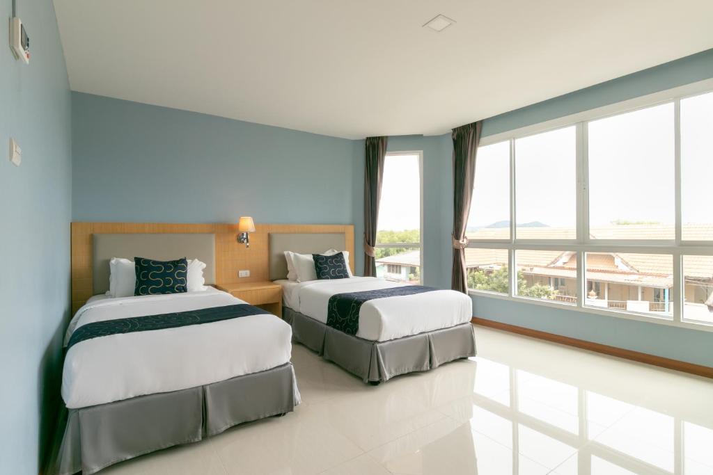 Postel nebo postele na pokoji v ubytování Golden Beach Boutique Resort