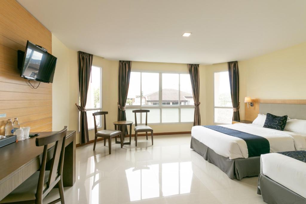 Postel nebo postele na pokoji v ubytování Golden Beach Boutique Resort
