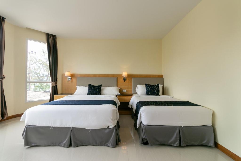 Postel nebo postele na pokoji v ubytování Golden Beach Boutique Resort