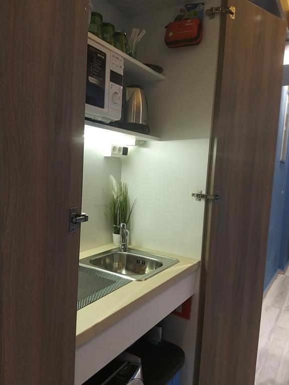Kuchyň nebo kuchyňský kout v ubytování Centralcityrooms