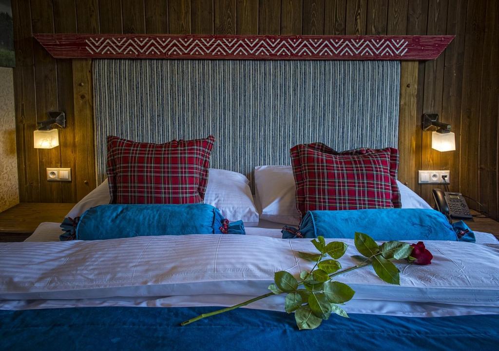 Postel nebo postele na pokoji v ubytování Grand Hotel**** Bachledka Strachan