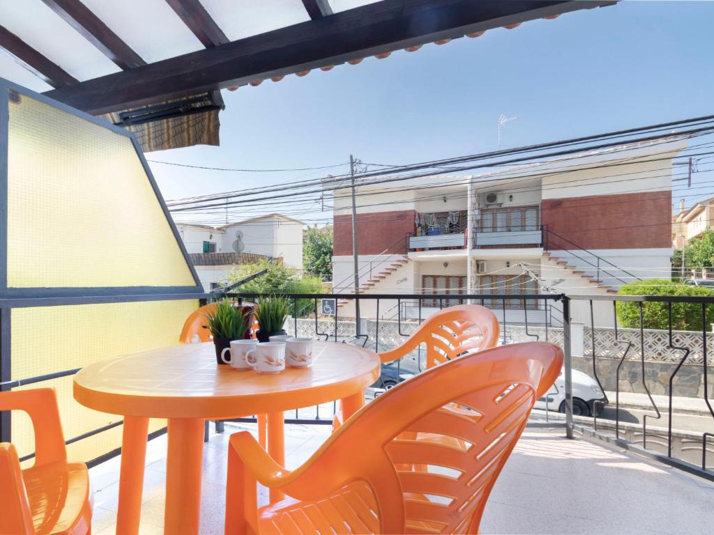 a patio with a table and chairs on a balcony at Apartment Marie by Interhome in Torredembarra