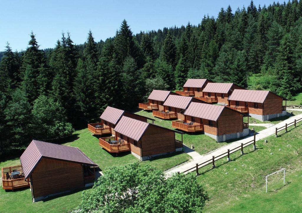 an overhead view of a group of wooden huts at Holiday Park Orava Bungalows in Dolný Kubín