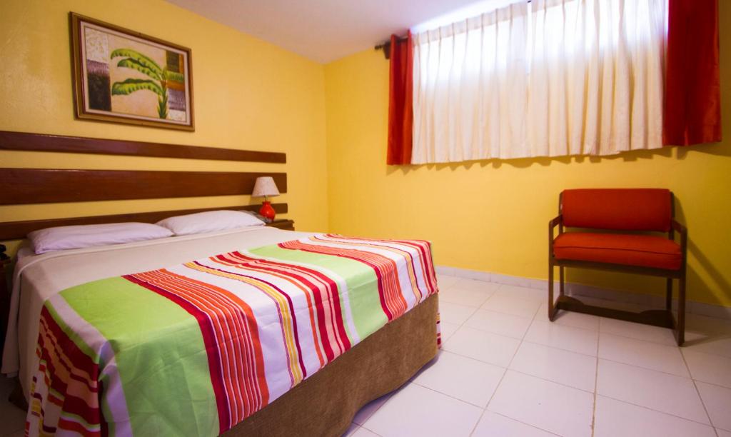 Postel nebo postele na pokoji v ubytování Ideal Villa Hotel