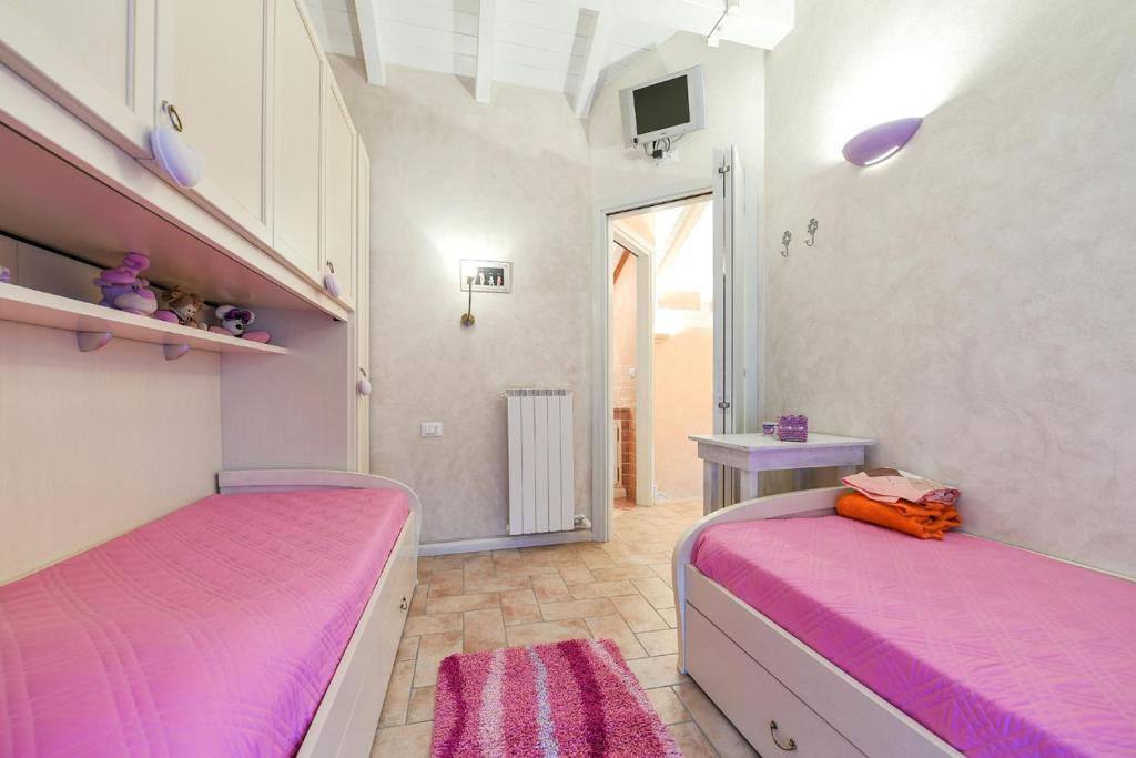 A bed or beds in a room at Lulù