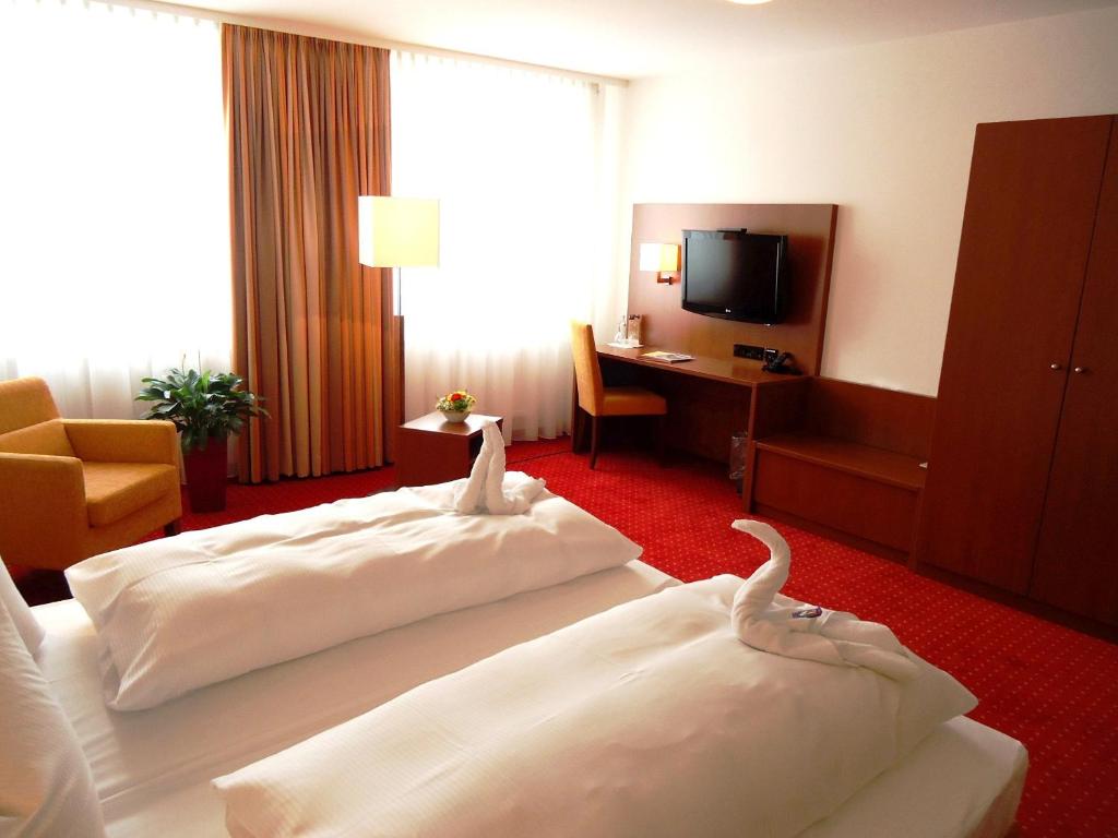 Postel nebo postele na pokoji v ubytování Hotel Gasthof Posthalter