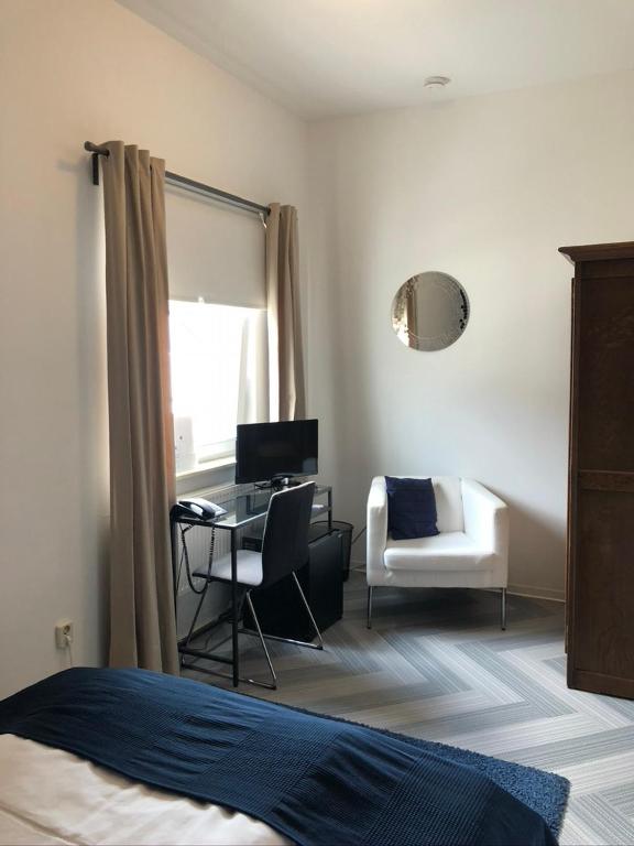 Postel nebo postele na pokoji v ubytování bensons hotel